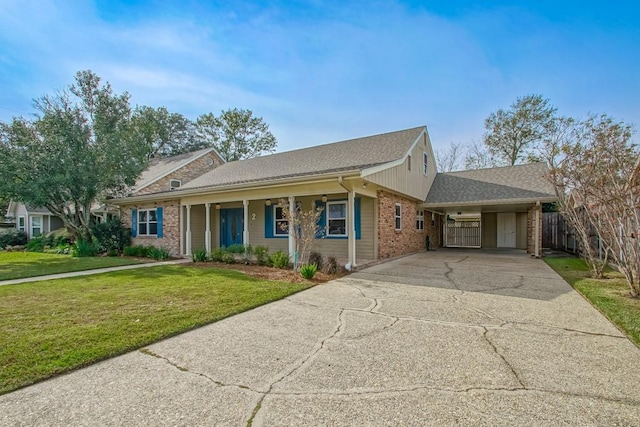 ranch-style home with a front yard, a porch, and a carport