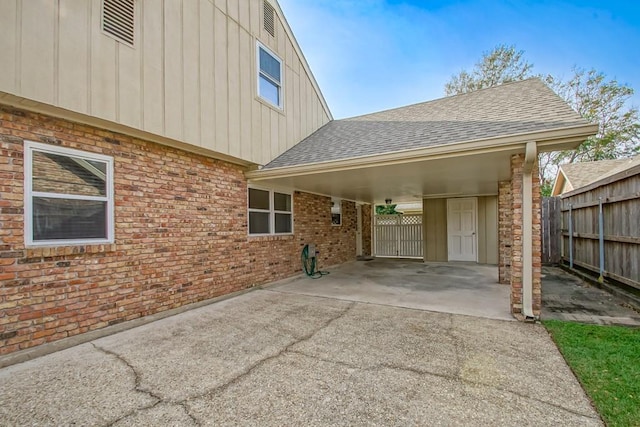 exterior space with a carport