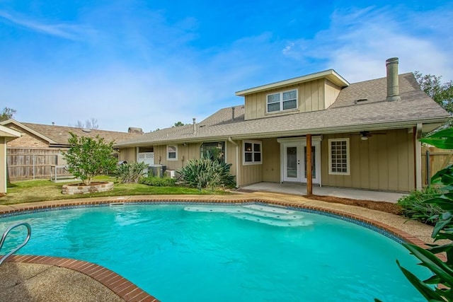 view of swimming pool featuring central AC unit, a patio area, and ceiling fan