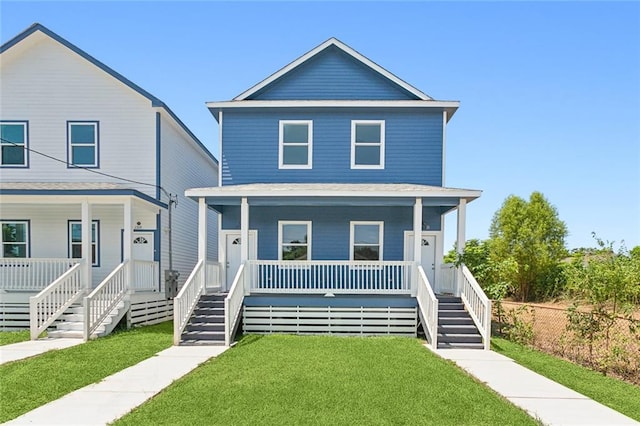 view of front of house with a porch and a front lawn