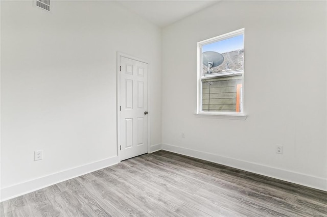 spare room featuring light hardwood / wood-style flooring