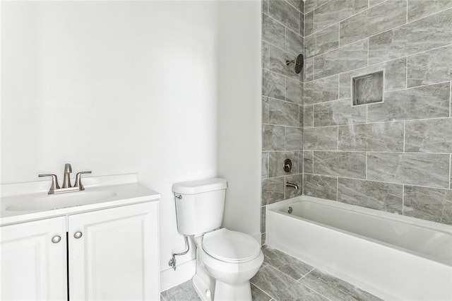 full bathroom with vanity, toilet, and tiled shower / bath