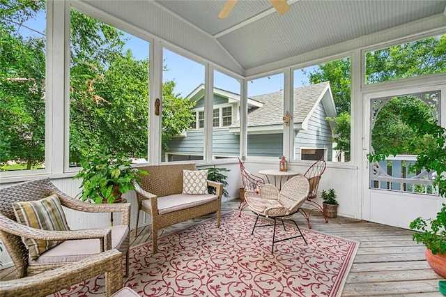 sunroom / solarium featuring vaulted ceiling and ceiling fan