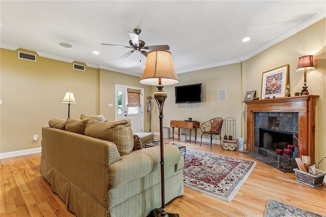 living room with visible vents and ornamental molding