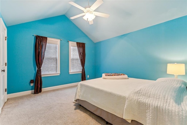 carpeted bedroom featuring lofted ceiling, ceiling fan, and baseboards