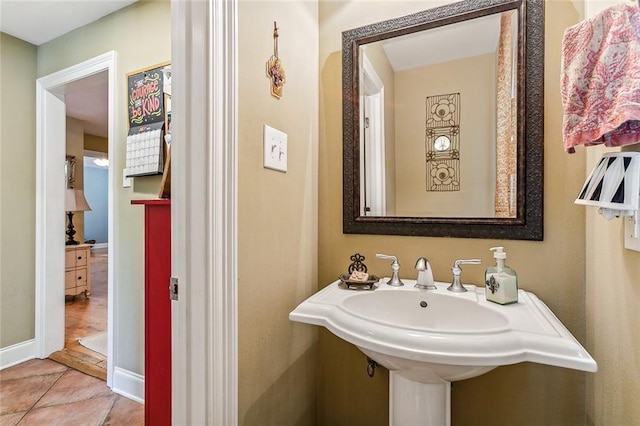 bathroom featuring tile patterned flooring and baseboards