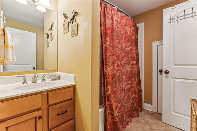 bathroom featuring tile patterned flooring and vanity