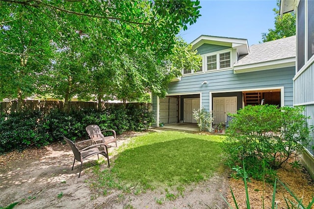 view of yard featuring a patio area and fence