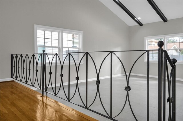 staircase featuring vaulted ceiling with beams