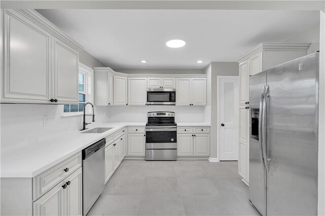 room details featuring white cabinetry and sink