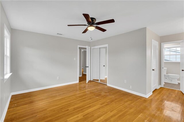 rear view of property with french doors, cooling unit, a deck, and a lawn