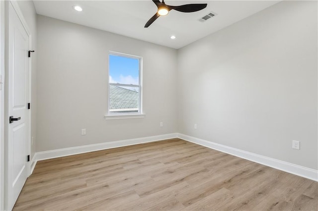 spare room with ceiling fan and light hardwood / wood-style floors