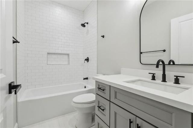 full bathroom featuring vanity, toilet, and tiled shower / bath