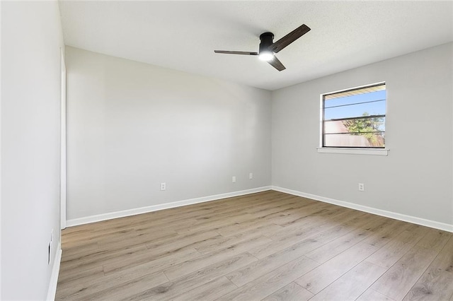 unfurnished room featuring light hardwood / wood-style flooring and ceiling fan