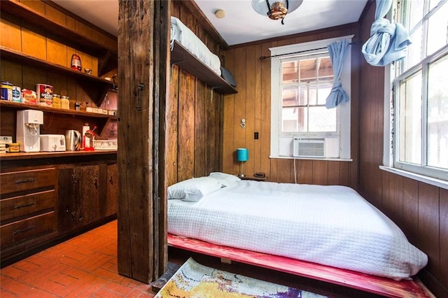 bedroom featuring wooden walls and cooling unit