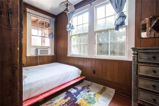 bedroom with wood walls