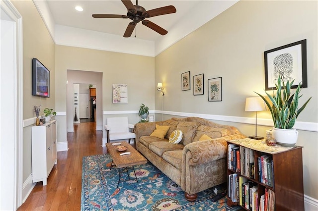 living room with hardwood / wood-style floors and ceiling fan