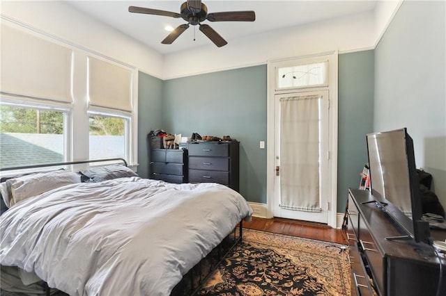 bedroom featuring ceiling fan and dark hardwood / wood-style floors