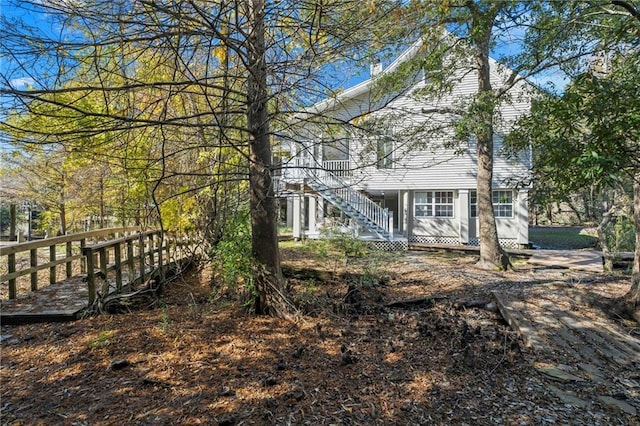 view of side of home featuring a wooden deck