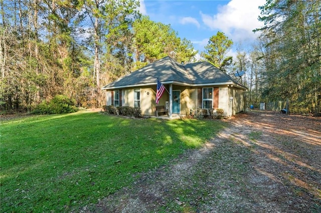 single story home featuring a front yard