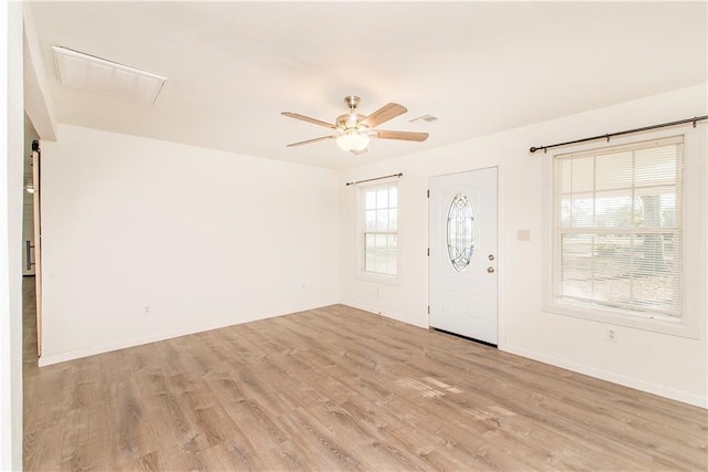 foyer featuring ceiling fan and light wood-type flooring