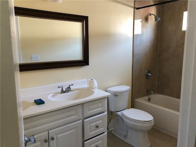 full bathroom with toilet, vanity, and tiled shower / bath