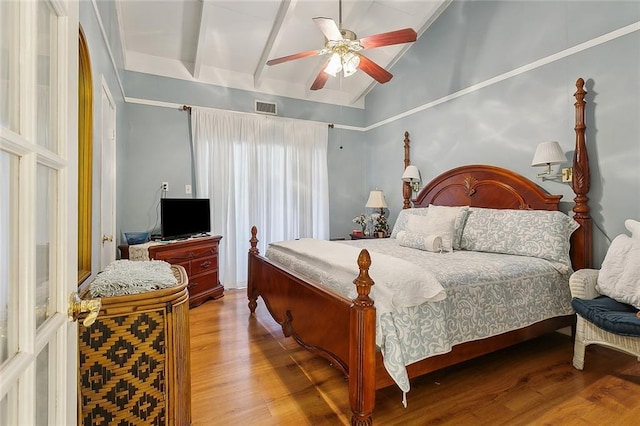 bedroom featuring hardwood / wood-style flooring, ceiling fan, and vaulted ceiling