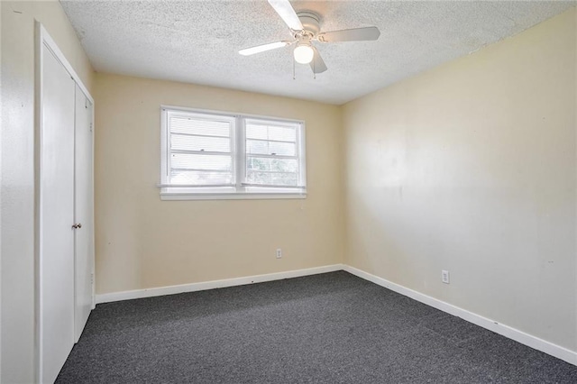 unfurnished bedroom featuring carpet, ceiling fan, and a textured ceiling