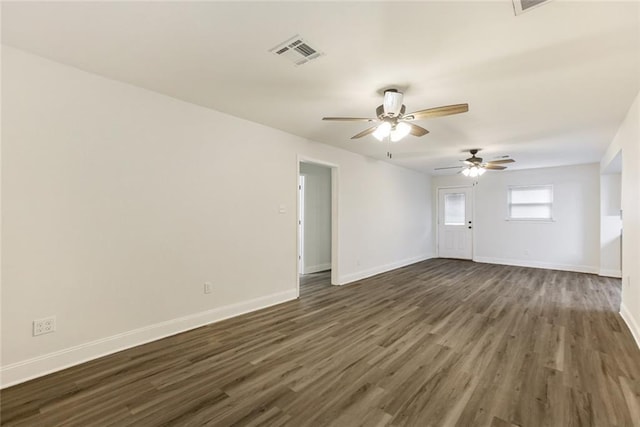 spare room featuring dark hardwood / wood-style floors and ceiling fan