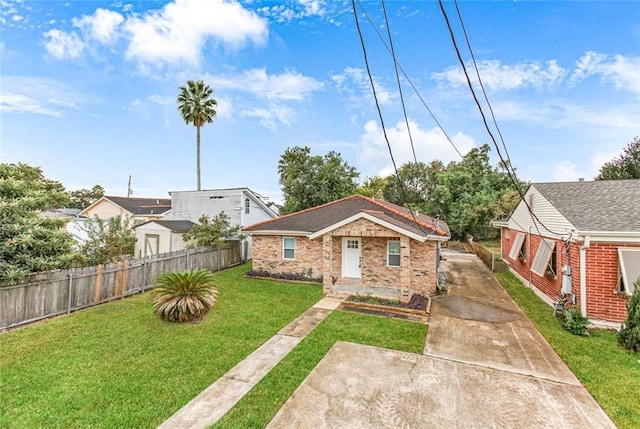 bungalow-style house featuring a front yard