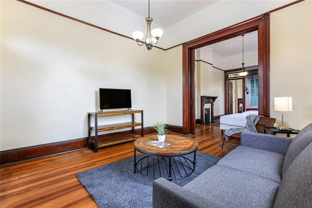 living room featuring hardwood / wood-style flooring and an inviting chandelier