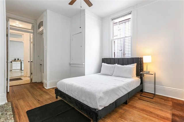 bedroom with hardwood / wood-style flooring and ceiling fan