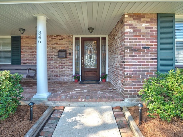 doorway to property with a porch