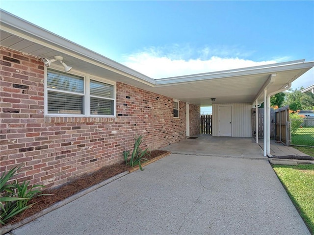 exterior space with a carport