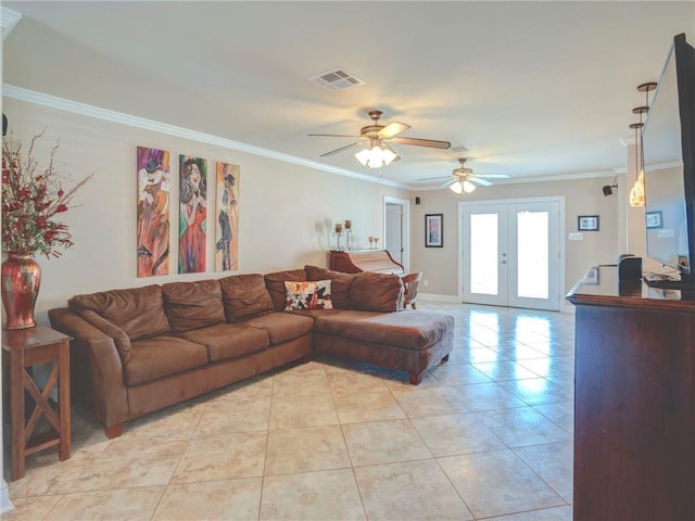 tiled living room featuring ceiling fan, crown molding, and french doors