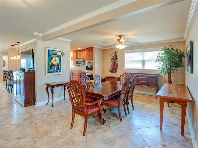 tiled dining area with ceiling fan and ornamental molding