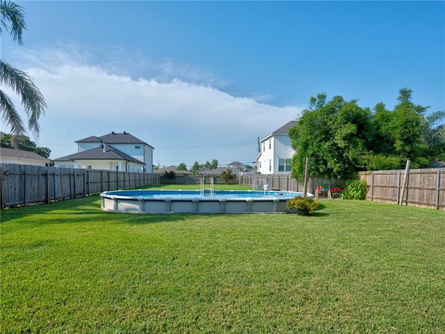 view of yard featuring a fenced in pool