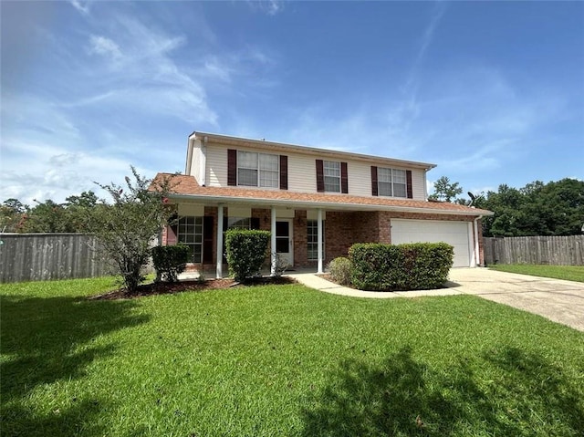 view of front property featuring a garage and a front lawn