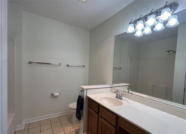 bathroom with vanity, a shower, tile patterned flooring, toilet, and a textured ceiling