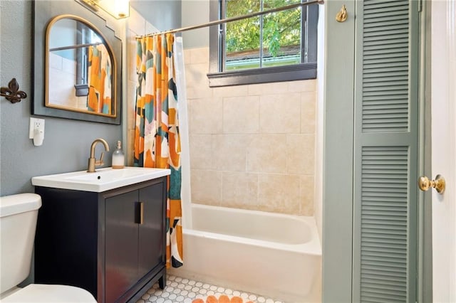 full bathroom featuring tile patterned floors, vanity, shower / tub combo, and toilet