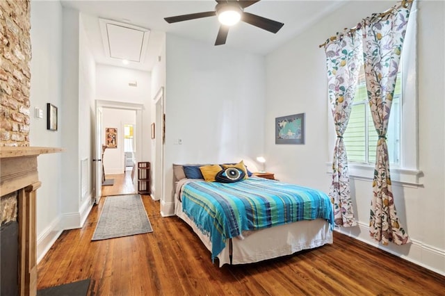 bedroom with ceiling fan and dark wood-type flooring