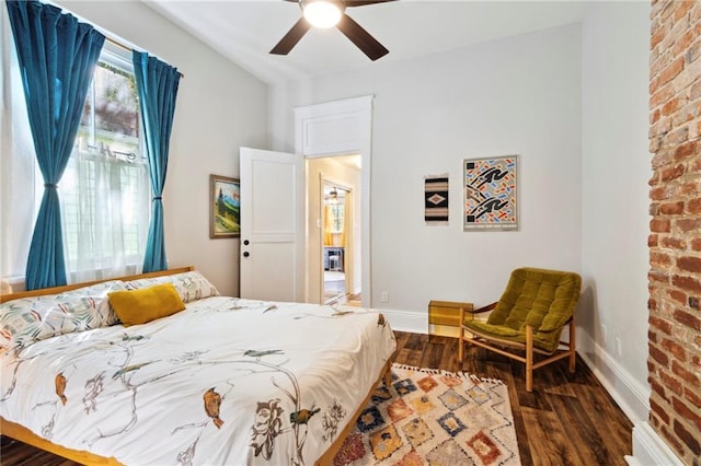 bedroom featuring dark hardwood / wood-style flooring and ceiling fan