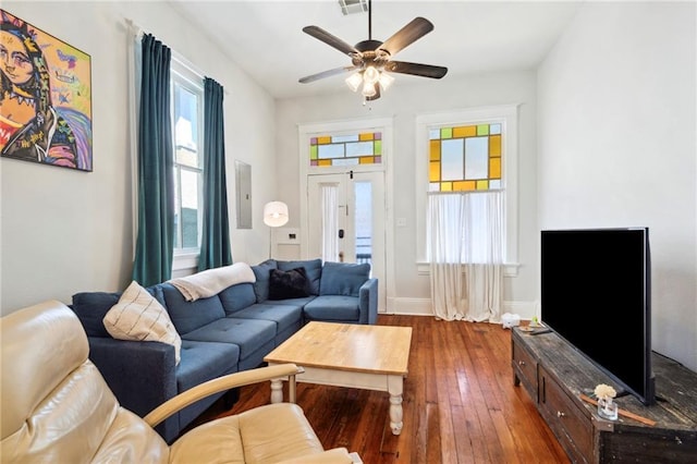 living room with ceiling fan and dark hardwood / wood-style floors