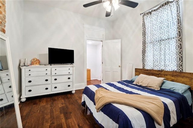 bedroom featuring ceiling fan and dark hardwood / wood-style flooring