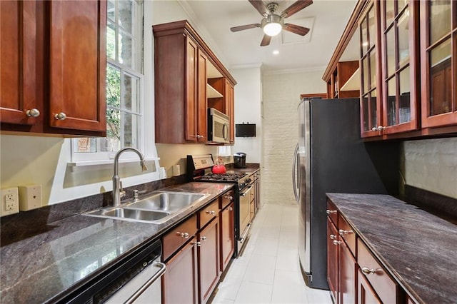 kitchen with appliances with stainless steel finishes, ornamental molding, ceiling fan, sink, and light tile patterned floors