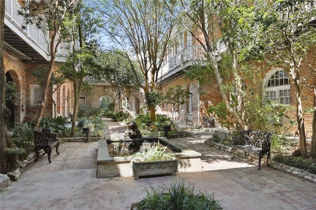 view of patio with a balcony