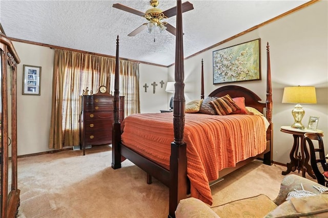 carpeted bedroom with ceiling fan, crown molding, and a textured ceiling