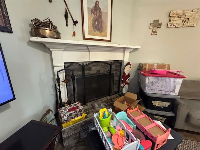 interior details with a tiled fireplace