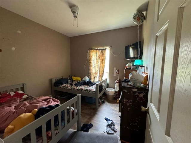 bedroom with hardwood / wood-style floors