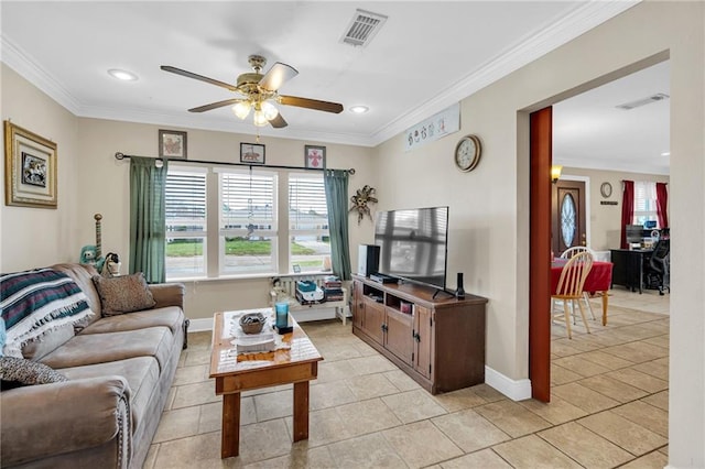 living room with ceiling fan, light tile patterned floors, and ornamental molding